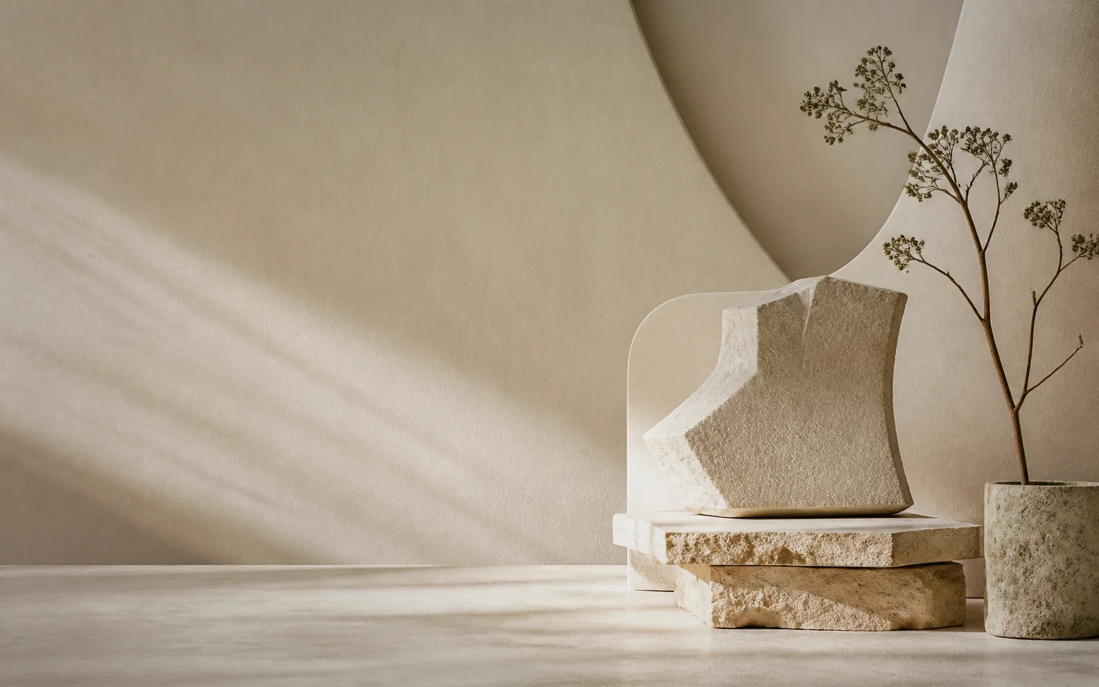 Warm ivory architectural forms, limestone blocks, and a dried botanical stem